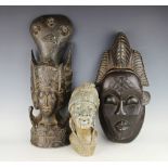 A South African carved stone bust of a man, with two hardwood tribal carvings ,