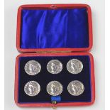 A cased set of silver buttons, Miller Brothers, Birmingham 1902, cast as a Roman type coin,