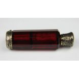 A Victorian double ended scent bottle, the faceted red glass body with white metal mounts,