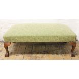 A 20th century country house stool, with green upholstered top, on cabriole legs and pad feet,