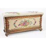 A 1920's carved oak blanket chest, with tapestry top and sides,