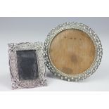 Two Continental silver photograph frames, to include a circular and rectangular example,