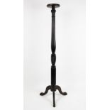 An Edwardian mahogany jardiniere stand / torchere, with fluted column, on tripod base,
