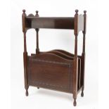 An Edwardian mahogany book trough / Canterbury, on turned legs,