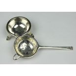 A silver tea strainer and stand, Cooper Brothers and Sons Sheffield 1937,