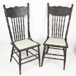 A pair of American style stained beech kitchen chairs, with upholstered seats, on turned legs,