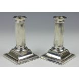 A pair of Victorian silver candlesticks, Martin Hall & Co, London 1884,