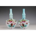 A pair of Victorian glass vases, each opaque blue vase enamelled with floral sprays and Dragonfly,