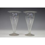 A pair of Victorian etched glass posy vases, each decorated with a floral garland,