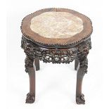 A 19th century Chinese hardwood jardiniere stand, with inset marble top,