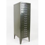 A pillar chest of eighteen vintage green metal filing drawers, 99cm H,