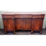 An early Victorian inverted break front mahogany sideboard,