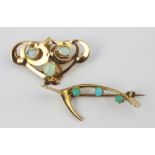 An opal and yellow metal Art Nouveau brooch, the three cabochon opals within a sinuous surround,