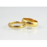 A 22ct yellow gold wedding band, weight 7.2gms, an 18ct yellow gold wedding band weight 3.