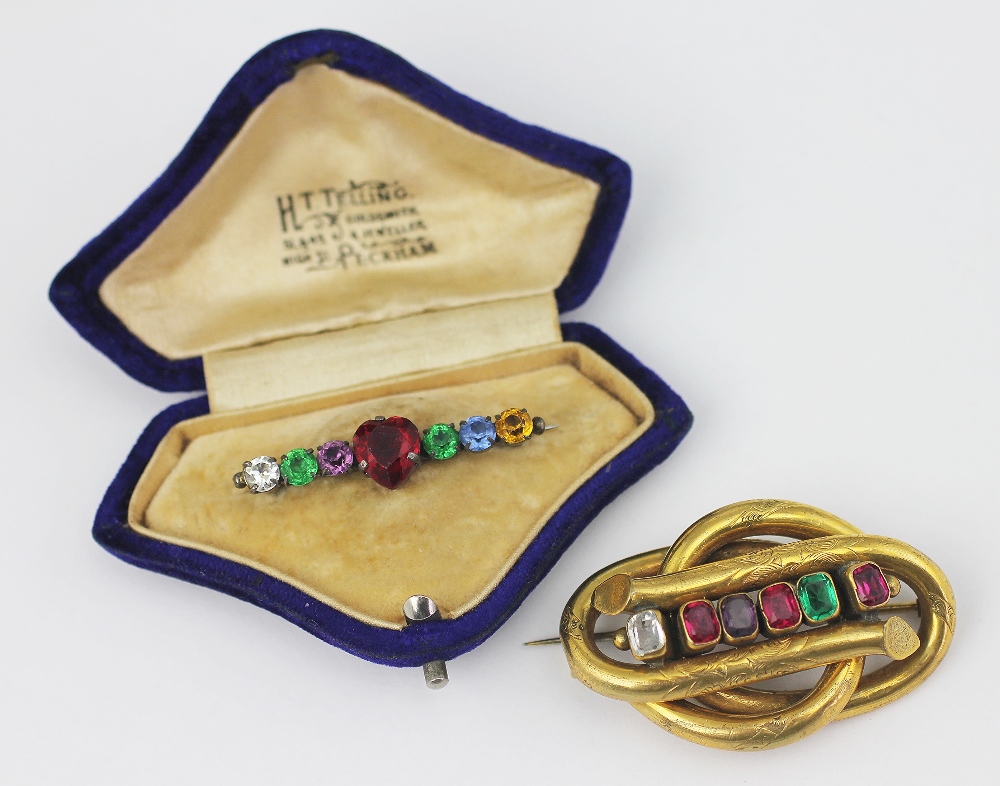 A Victorian REGARD brooch, designed as an entwined knot set with six paste stones,