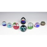 A selection of seven Caithness paperweights comprising; Windfall G17017, Myriad K24433,
