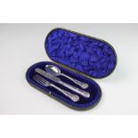A cased silver kings pattern christening set, Wakely & Wheeler, London 1911, comprising a spoon,