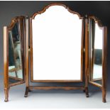 An early 20th century walnut tryptic mirror, with cushion frame,