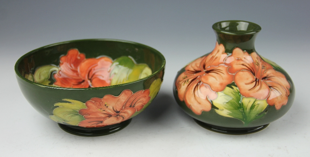 A Moorcroft Hibiscus pattern vase, of squat ovoid form, peach blooms against a green ground, 9. - Image 2 of 2