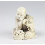 A Japanese finely carved ivory netsuke of an egg seller / tester, Meiji period, 1868-1912,
