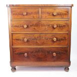 An early 19th century mahogany chest of drawers, with two short and three graduated long drawers,