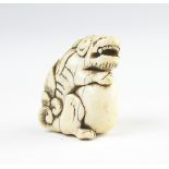 A Japanese carved ivory okimono of a ShiShi, Edo period, unsigned,