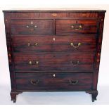 A late George III inlaid mahogany chest of drawers, with two short and three long drawers,