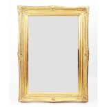A modern gilt framed rectangular wall mirror,