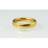 A 22ct yellow gold wedding band,