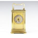 A late 19th century French lacquered brass carriage time piece,