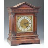 A late Victorian walnut eight day mantel clock,