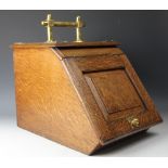 A Victorian Aesthetic oak and brass coal purdonium,