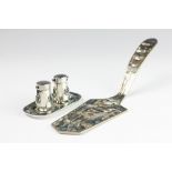 A continental white metal and abalone inset salt and pepper,