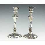 A pair of Victorian Elkington & Co silver plated candlesticks,