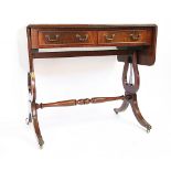 A Regency style mahogany Pembroke table, with two drawers and lyre end supports,