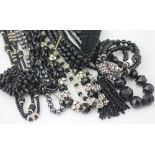 A collection of black bead and other jewellery, to include; a black enamelled wide link chain,