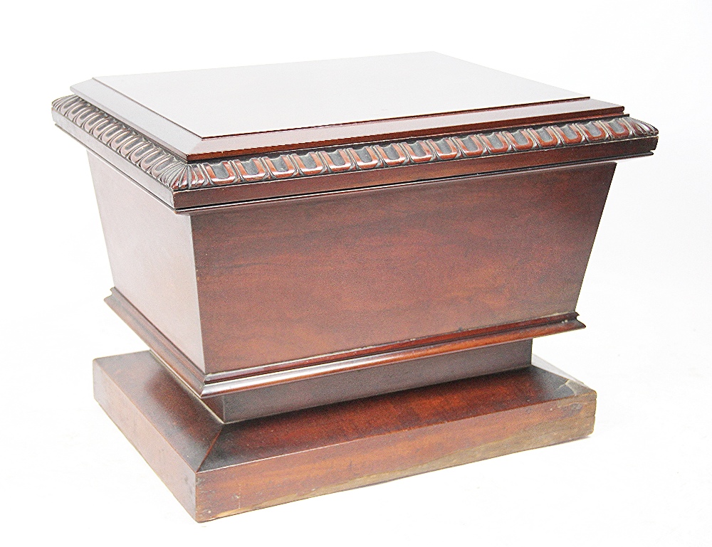 A Regency mahogany sarcophagus shaped cellarette,