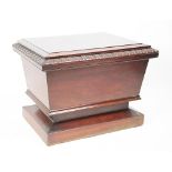 A Regency mahogany sarcophagus shaped cellarette,