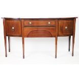 A George III inlaid mahogany bow front sideboard, with two drawers and two cupboard doors,