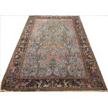 A Kashmir tree of life rug, worked with animals and flowers against a duck egg blue ground,