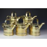 Five 19th century and later country house brass hot water cans, including two by Army and Navy,