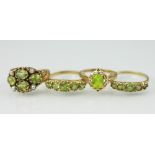 Four peridot set rings, to include; a four stone and seed pearl set example,