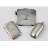 Three silver vesta cases to include; a George V cushion shaped example, William Neale,