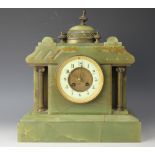 A late Victorian green onyx eight day mantle clock,
