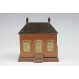 A wooden automatic match dispenser, 19th century, designed as a house with brass and copper mounts,