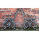 A pair of 19th century Coalbrookdale style cast iron bench ends, decorated with dolphins,