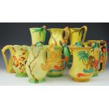 A collection of ten Burleigh Ware jugs, comprising three squirrel jugs, three parrot jugs,