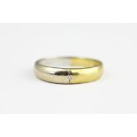 A bi-colour gold diamond set ring, stamped '750', weight 3.