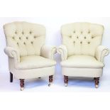 A pair of button back salon chairs, with patterned ivory upholstery,