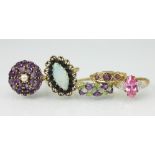 Five dress rings, to include; an opal and sapphire marquise shaped ring,